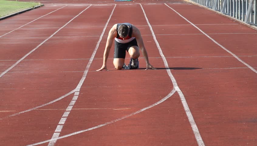 Slow motion of four sprinters on start Stock Video Footage by ©amriphoto  #102756702