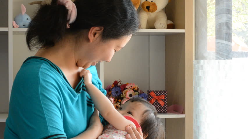 Asian Mother Breastfeeding Her Baby Stock Footage Video (100% Royalty