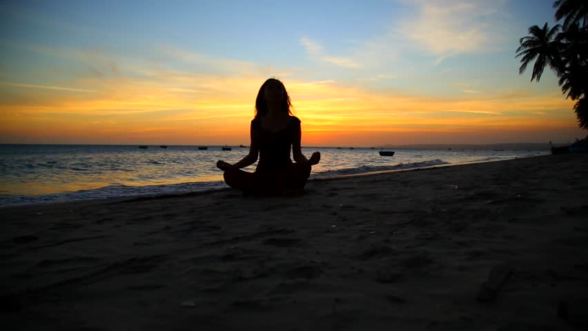 Young Practicing Yoga By The Sea At Sunset Stock Footage Video Young Practicing Yoga By The Sea At Sunset Stock Footage Video 8748367 Shutterstock