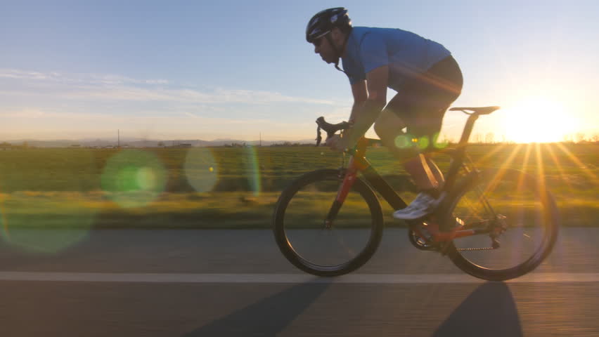 Cyclist Working Out. Training Fitness Outdoors On Bike. Tracking Shot ...