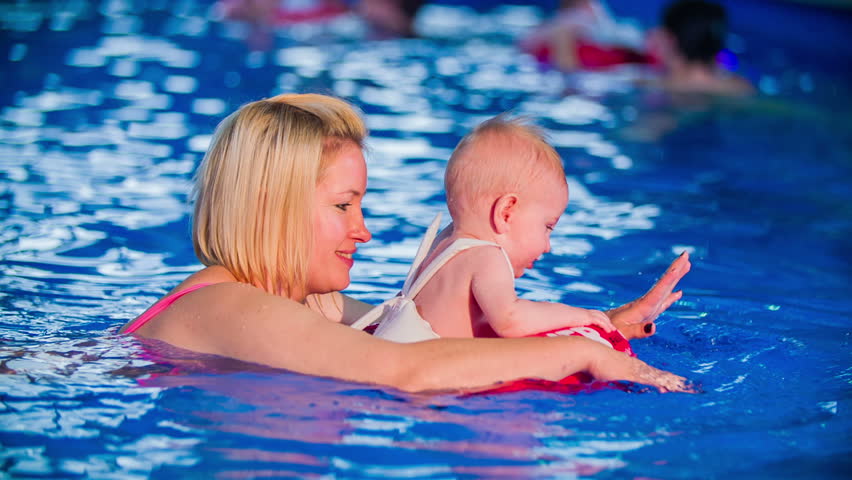 Image result for mother swimming with baby